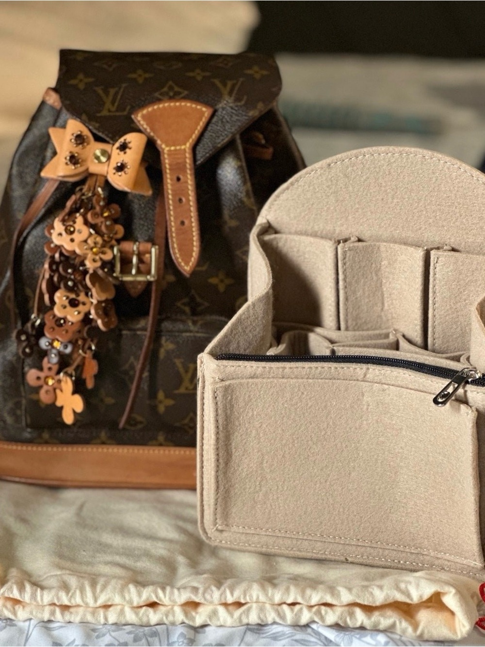Louis Vuitton Brown Monogram Backpack with Tan Leather Trim and Flower Charm